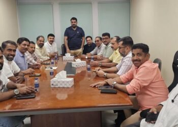 Dubai KMCC Kozhikode District Committee members meeting to discuss UDF election campaign and "Vote Flight" initiative in Dubai office.