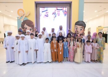UAE Minister of Economy Abdulla bin Touq Al Marri interacting with young entrepreneurs at GDRFA Young Merchant 2026 exhibition in Dubai.