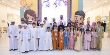 UAE Minister of Economy Abdulla bin Touq Al Marri interacting with young entrepreneurs at GDRFA Young Merchant 2026 exhibition in Dubai.