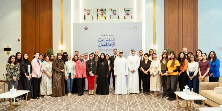 Hessa bint Essa Buhumaid with the third batch of licensed social professionals at Al Warqa Majlis in Dubai.