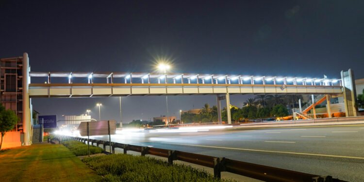Pedestrian bridge in Dubai equipped with smart motion-sensor LED lighting.