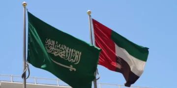 Flags of the United Arab Emirates and the Kingdom of Saudi Arabia flying together.