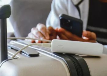 Cabin crew inspecting power bank baggage regulations before passenger flight boarding