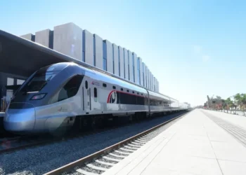 Etihad Rail passenger train traveling on the track in the UAE