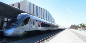 Etihad Rail passenger train traveling on the track in the UAE