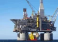 Commercial oil tanker navigating strategic maritime trade route during global supply crisis.