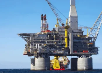 Commercial oil tanker navigating strategic maritime trade route during global supply crisis.