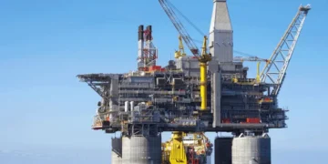 Commercial oil tanker navigating strategic maritime trade route during global supply crisis.