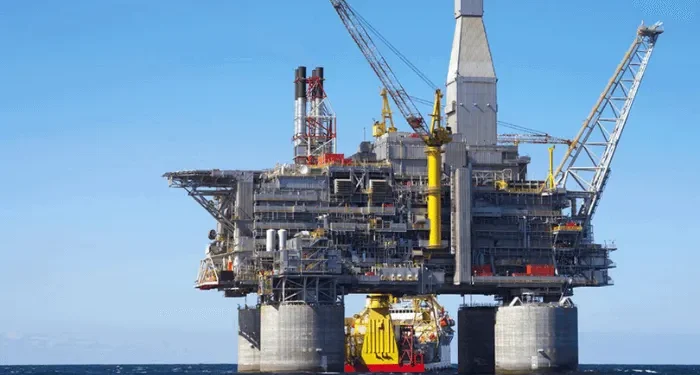 Commercial oil tanker navigating strategic maritime trade route during global supply crisis.