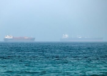 An oil tanker has been disabled off Ash Shishah, Oman, after an unidentified projectile hit its engine room. Crew reported safe as security alerts widen near Strait of Hormuz.