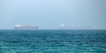 An oil tanker has been disabled off Ash Shishah, Oman, after an unidentified projectile hit its engine room. Crew reported safe as security alerts widen near Strait of Hormuz.