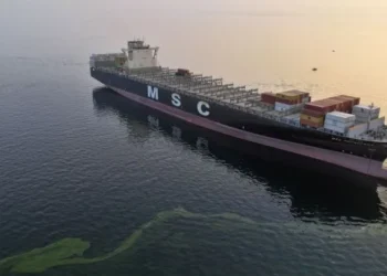 Large oil tanker navigating narrow maritime passage in the Strait of Hormuz