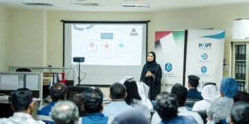 Abu Dhabi Civil Defence officers instructing industrial workers on hazardous materials handling and safety equipment.