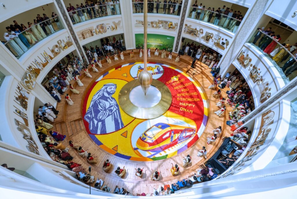 Healthcare workers at Burjeel Medical City standing around a 250-square-meter floral carpet featuring UAE President Sheikh Mohamed bin Zayed Al Nahyan.