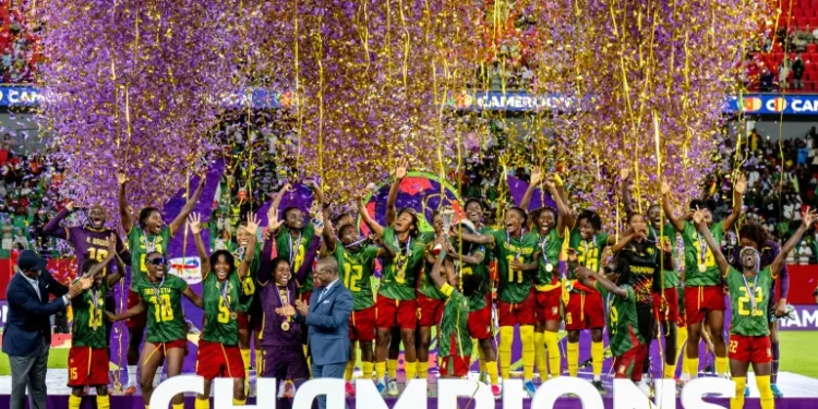 Cameroon women's national football team celebrating with the WAFCON trophy in Rabat.