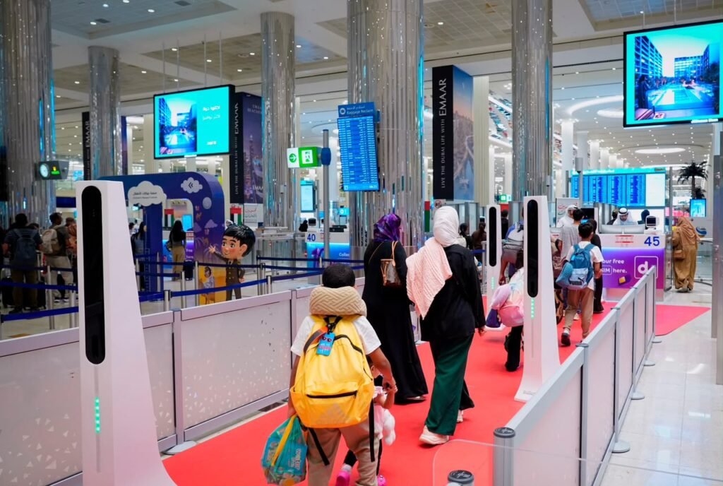Passengers completing automated immigration clearance at Dubai Airport smart gates