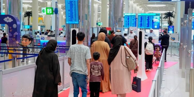 Passengers completing automated immigration clearance at Dubai Airport smart gates