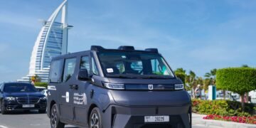 Baidu Apollo Go autonomous Robotaxi driving on a street in Dubai, UAE