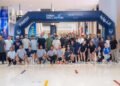 GDRFA Dubai immigration officers participating in the Dubai Mallathon indoor walking initiative at a local shopping mall.