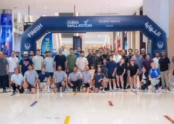 GDRFA Dubai immigration officers participating in the Dubai Mallathon indoor walking initiative at a local shopping mall.