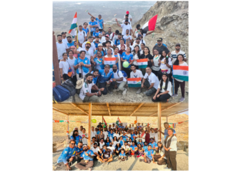 Expatriates hoisting Indian and UAE national flags atop Masfout Mountains in Ajman.