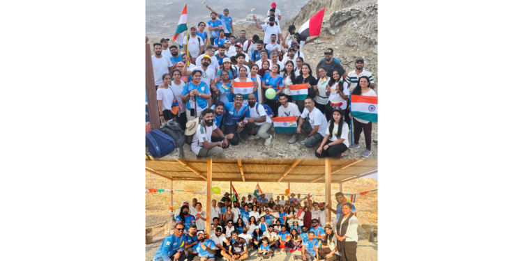 Expatriates hoisting Indian and UAE national flags atop Masfout Mountains in Ajman.
