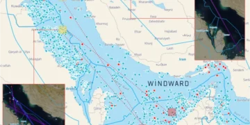 Commercial oil tanker navigating open waters near the Strait of Hormuz under high maritime security patrol.