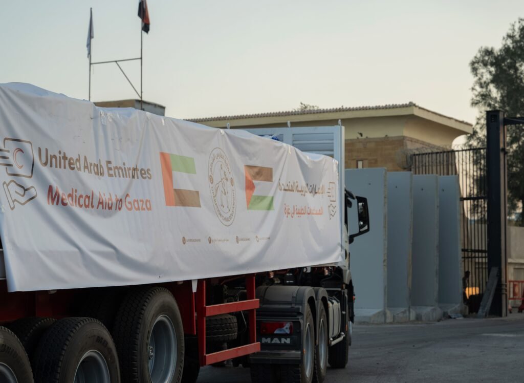 UAE humanitarian aid trucks prepared for Gaza at Al Arish logistics center.