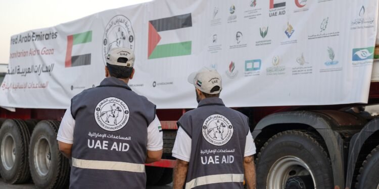 UAE humanitarian aid trucks prepared for Gaza at Al Arish logistics center.