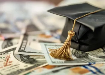 Higher education diploma and university campus background illustrating international student scholarships