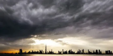 Dark rain clouds over the UAE highway during rain warning