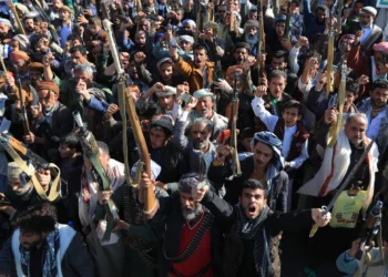 Houthi militia supporters brandish weapons as they rally in Sanaa, Yemen, on October 9, 2026.